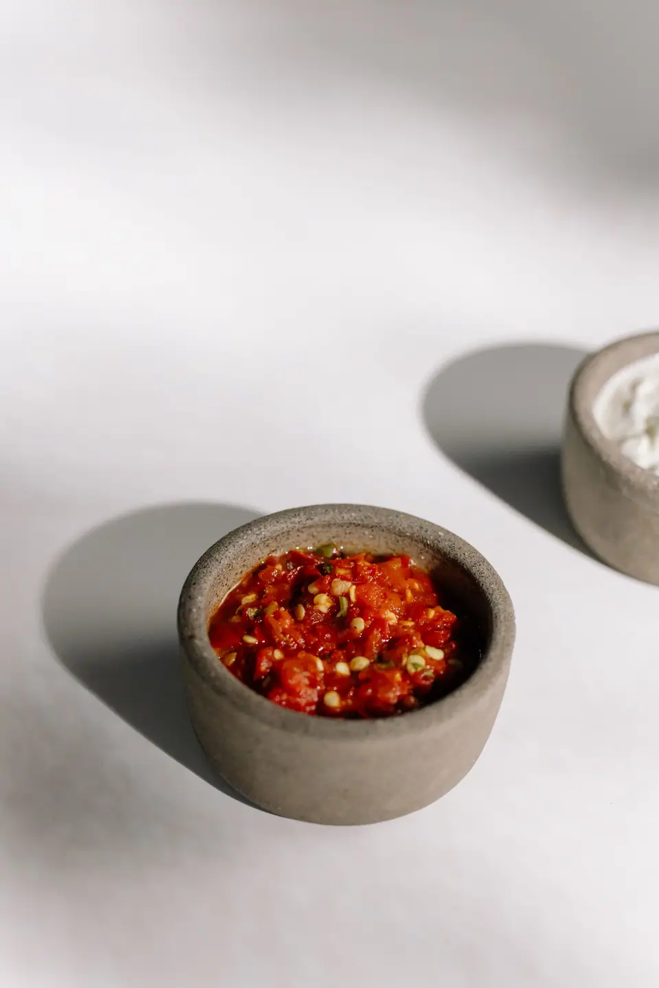 Red chili paste in a small stone bowl