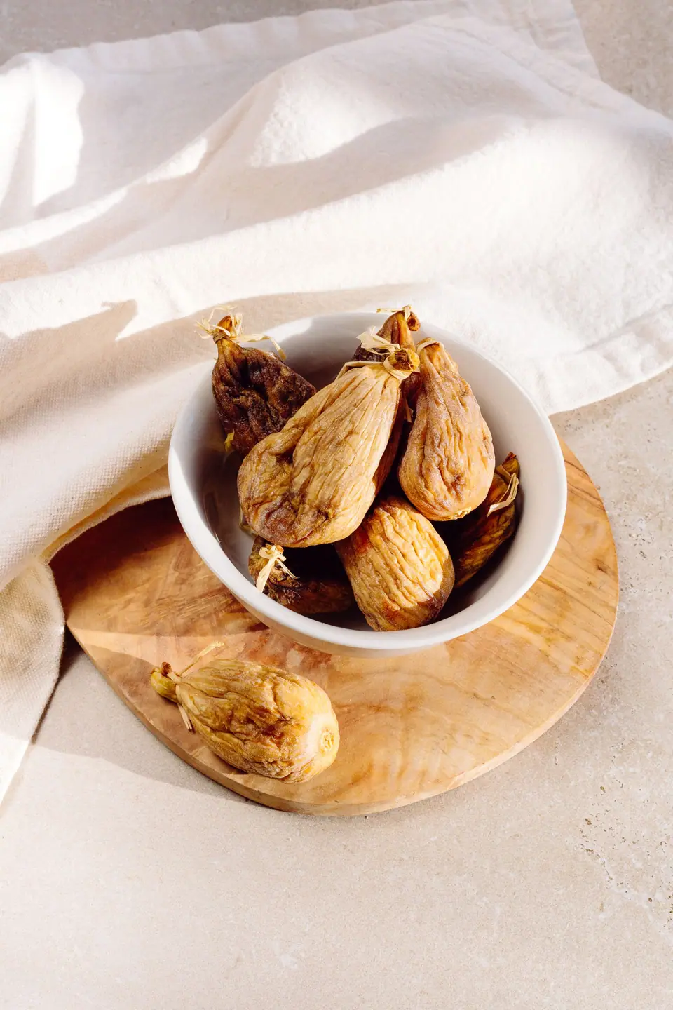 Dried figs in a white bowl