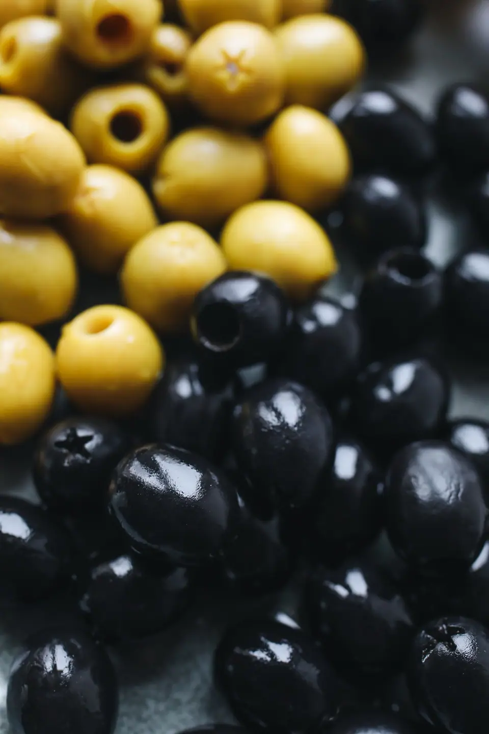 Close-up of green and black olives