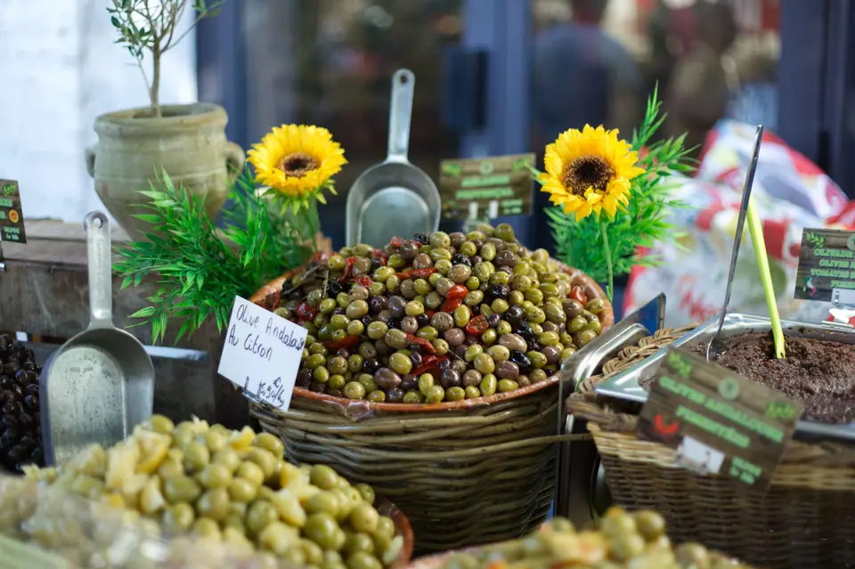Baskets of olives on a market stall