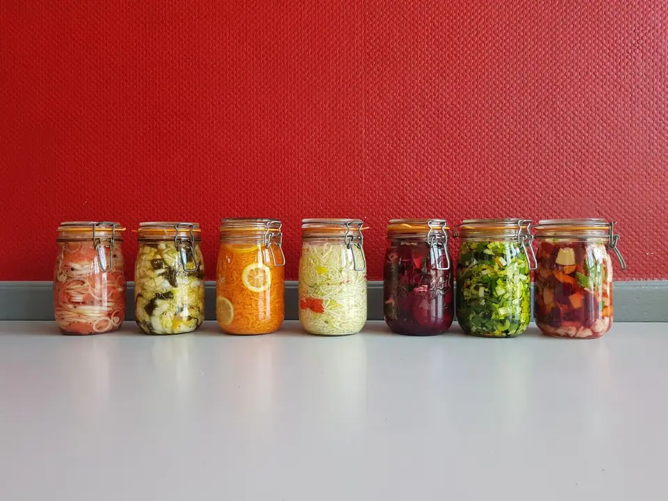 Row of jars of prepared vegetables
