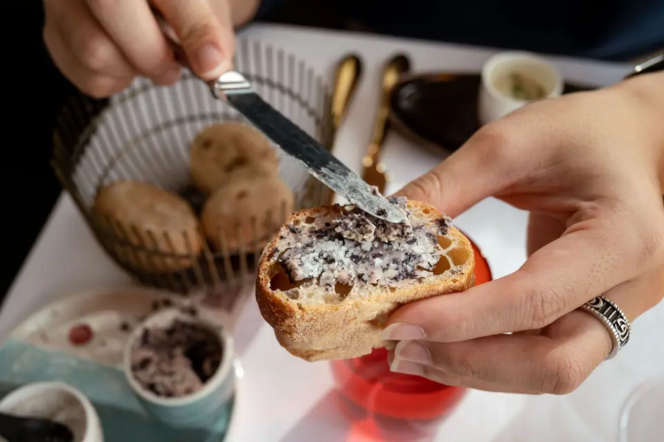 Black olive tapenade spread on bread